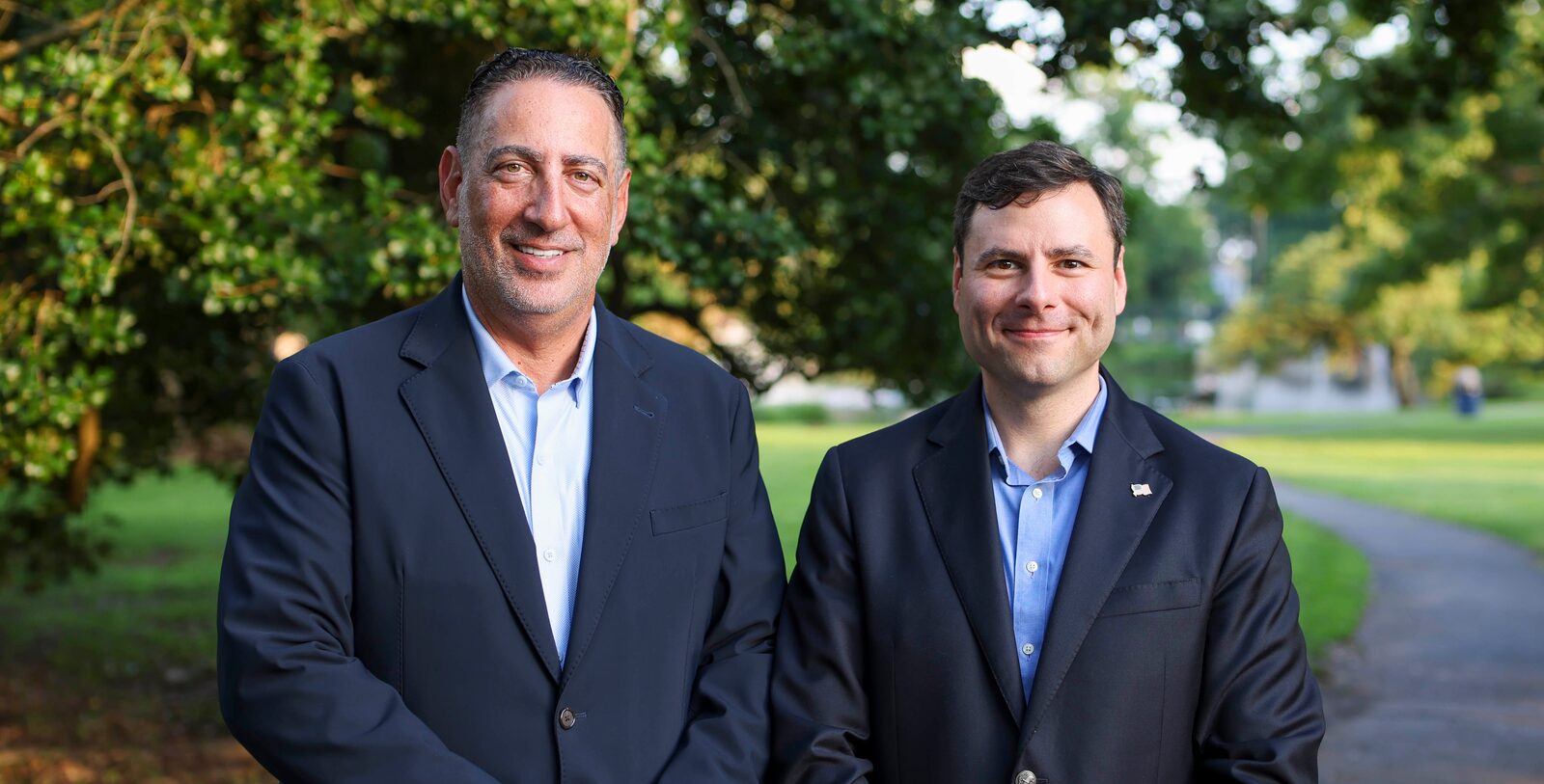 Frank Saccomandi and Ben Stoller standing together on a path in a Millburn park
