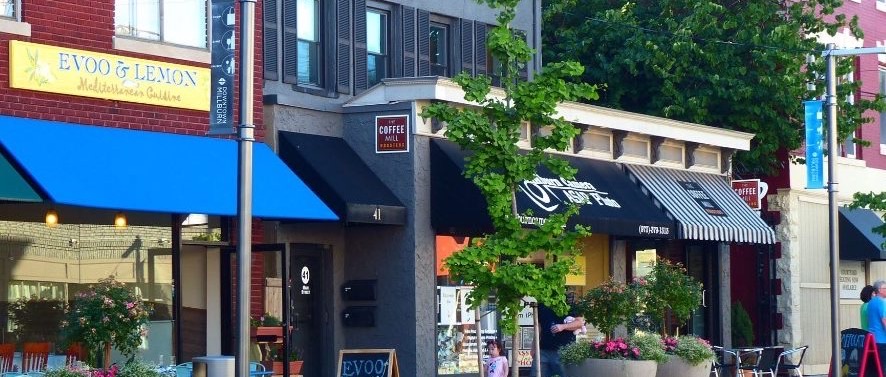 Storefronts and sidewalk planters in downtown Millburn